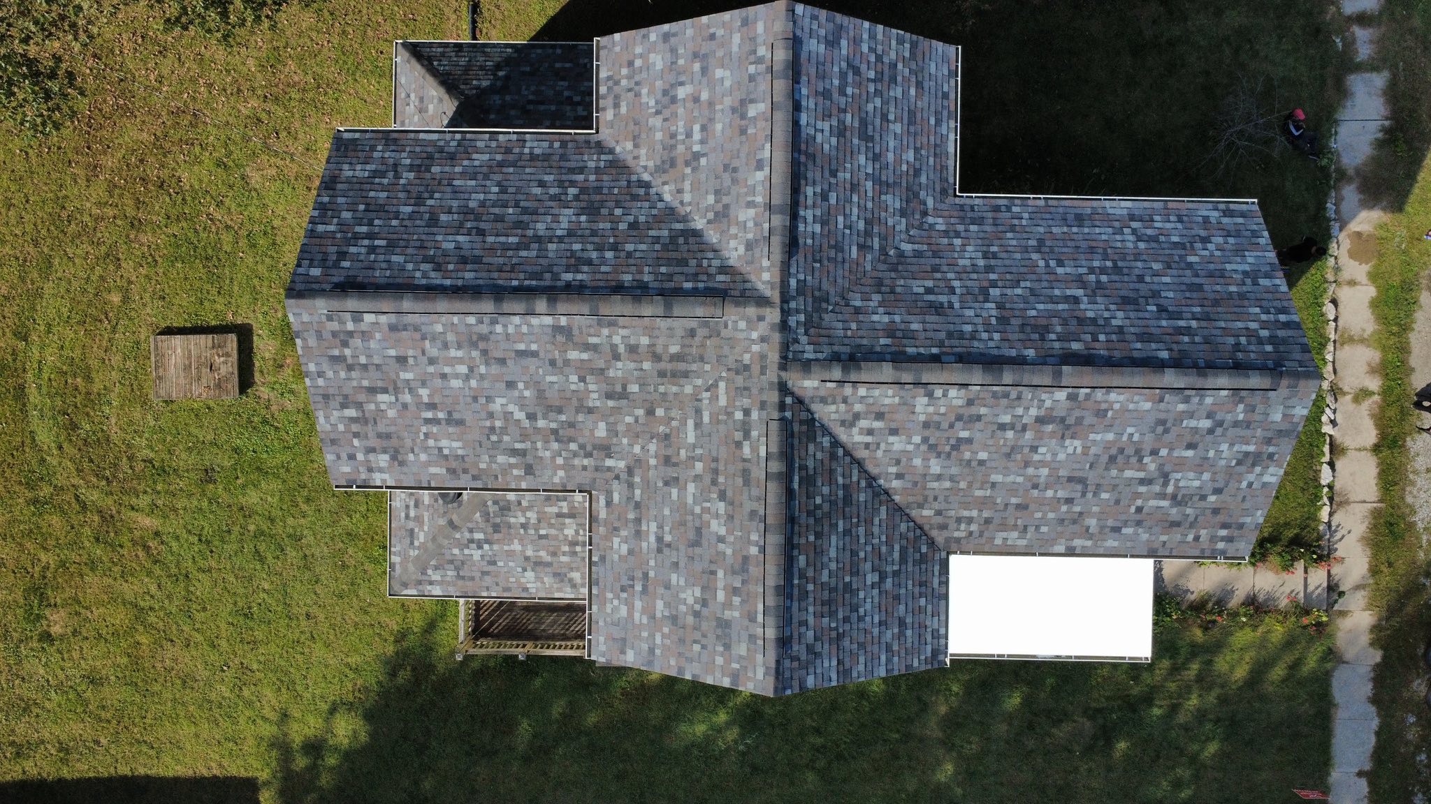 Top-down shot of a designer-series shingle replacement